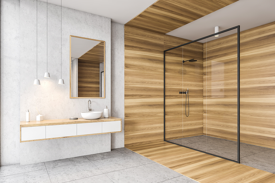 Wooden and white bathroom with sink, mirror and drawers, shower with glass doors, side view. Minimalist design of modern bathroom with tiled floor 3D rendering, no people